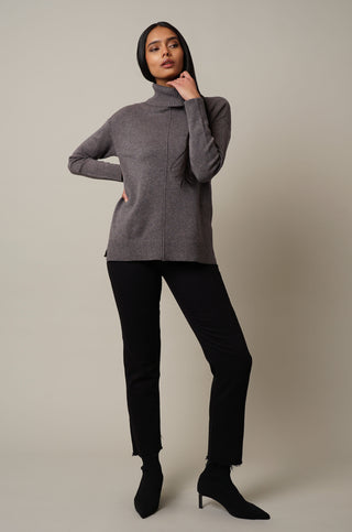 Model is wearing the Turtle Neck Pullover in Grey Violet.