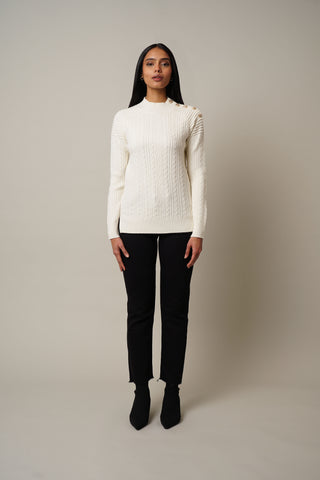 Model is wearing the Cable Knit Pullover with Buttons in Cream.