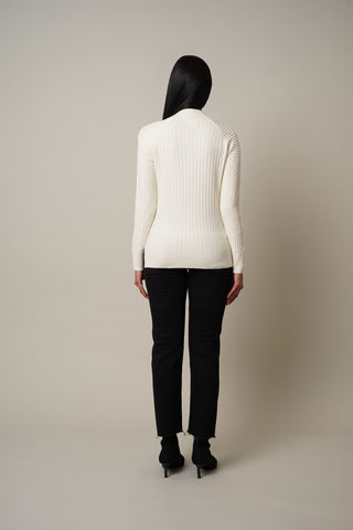 Model is wearing the Cable Knit Pullover with Buttons in Cream.