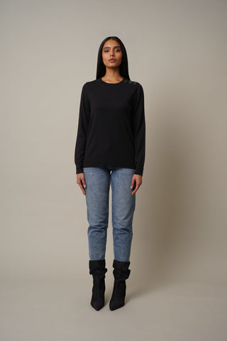 Model is wearing the Crew Neck Pullover with Shoulder Detail in Black.