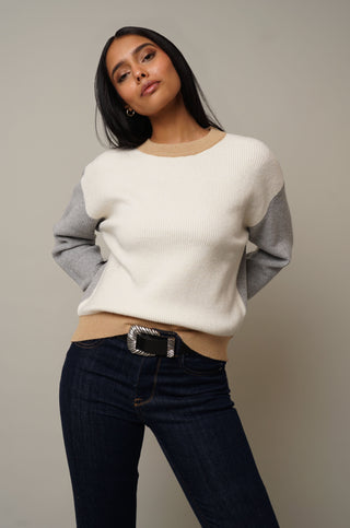 Model is wearing the Color Block Pullover in Cream/Grey.