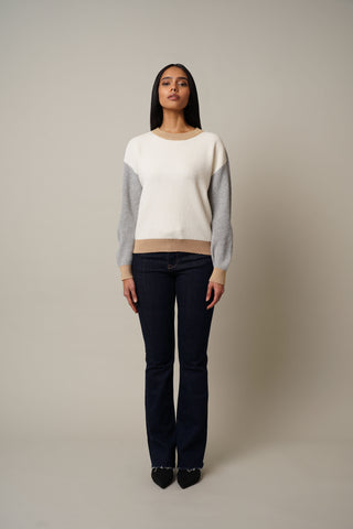 Model is wearing the Color Block Pullover in Cream/Grey.