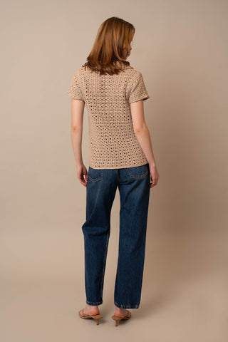 Model is wearing the Short Sleeve Crochet Polo by Cyrus in Oatmeal Cookie Combo