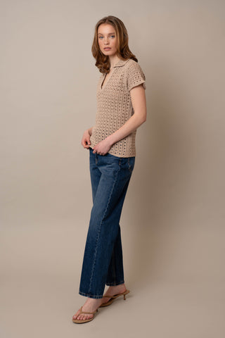 Model is wearing the Short Sleeve Crochet Polo by Cyrus in Oatmeal Cookie Combo