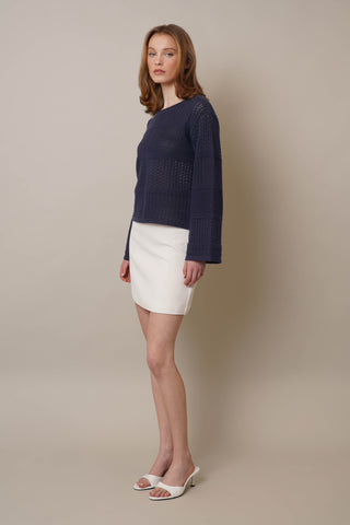 Model is wearing the Novelty Crochet Pullover by Cyrus in Eclipse