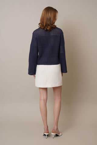 Model is wearing the Novelty Crochet Pullover by Cyrus in Eclipse