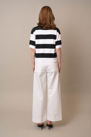 Model is wearing the Wide Stripe Short Sleeve Pullover by Cyrus in White/Black