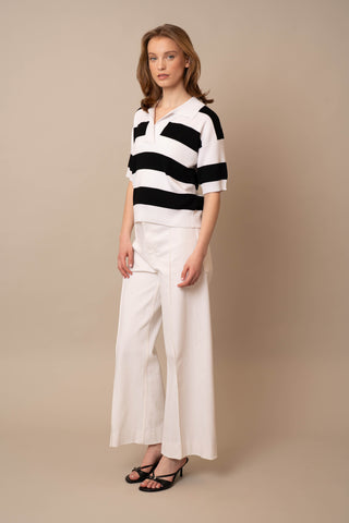Model is wearing the Wide Stripe Short Sleeve Pullover by Cyrus in White/Black