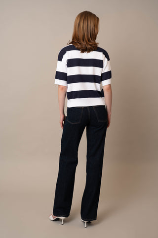 Model is wearing the Wide Stripe Short Sleeve Pullover by Cyrus in White/Eclipse