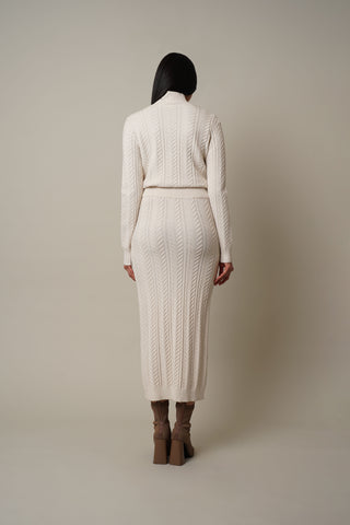 Model is wearing the Cable Knit Skirt in Cream.