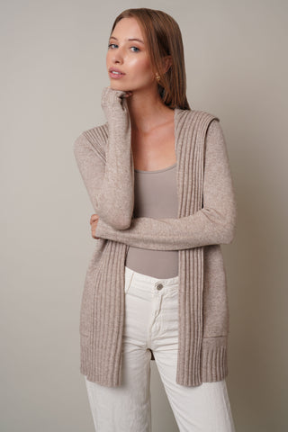 Model is wearing the Hooded Cardigan with Ribbed Trimby Cyrus in Buckskin Heather