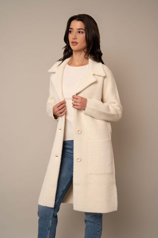 Model is wearing the Long Mink Coat in Vanilla Puff.