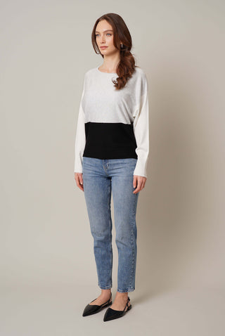 Model is wearing the color block dolman by Cyrus in Solver Heather Grey/Black/Bone