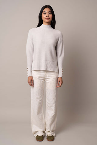 Model is wearing the mock-neck-pullover-with-button-cuff in Grey Goose Heather