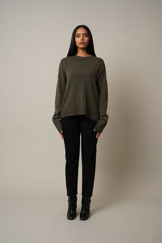 Model is wearing the Crew Neck Pullover in Burnt Olive.