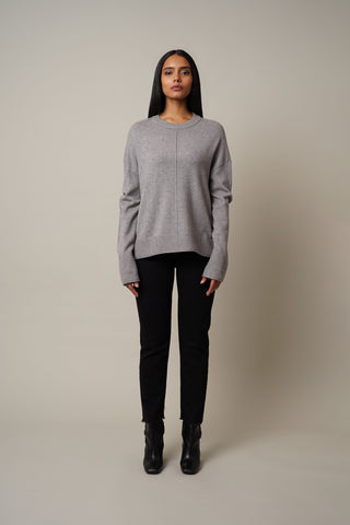Model is wearing the Crew Neck Pullover in Medium Heather Grey.