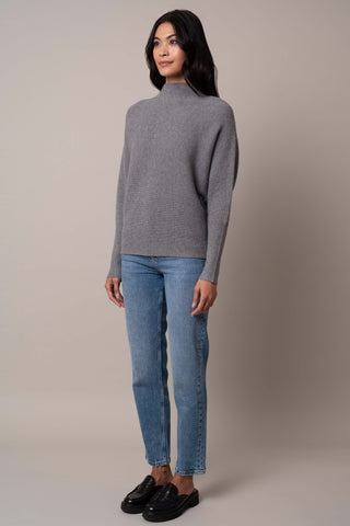 Model is wearing the funnel-neck-sweater-with-ribbed-cuff in Medium Heather Grey