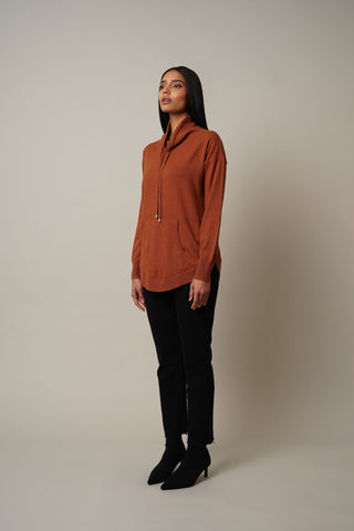 Model is wearing the Relaxed Fit Pullover in Spice Heather.