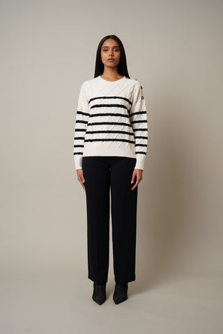 Model is wearing the Striped Cable Knit Pullover in Cream/Black.