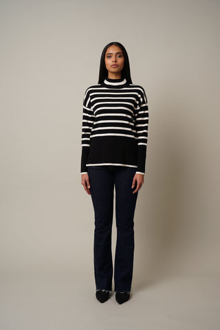 Model is wearing the Striped Mock Neck Pullover in Black/Cream.