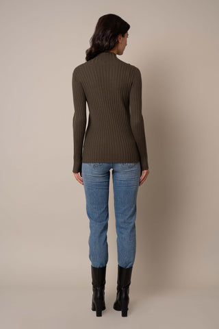 Model is wearing the Mock Neck Ribbed Pullover in Burnt Olive Heather.