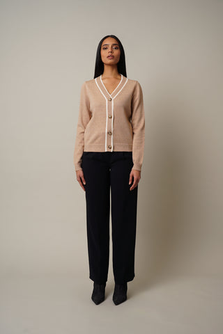 Model is wearing the Tipping Front Cardigan in Toffee/Cream.
