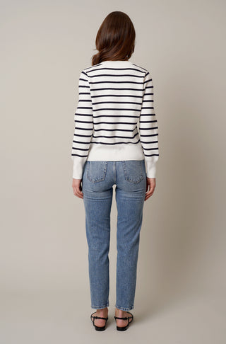 Model is wearing the striped button front cardigan by Cyrus in Bone/Eclipse