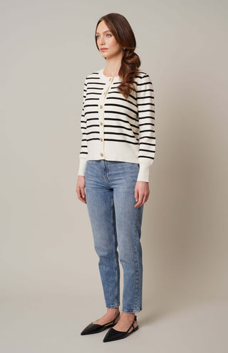 Model is wearing the striped button front cardigan by Cyrus in Cream/Black