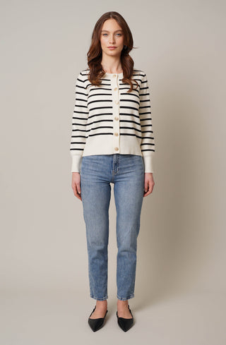 Model is wearing the striped button front cardigan by Cyrus in Cream/Black