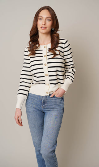 Model is wearing the striped button front cardigan by Cyrus in Cream/Black