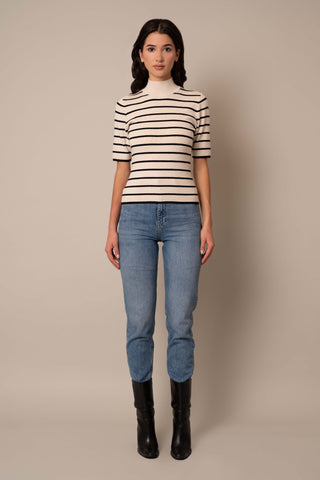 Model is wearing the Mock Neck Striped Pullover in Sand Heather/Black.