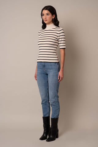 Model is wearing the Mock Neck Striped Pullover in Sand Heather/Black.