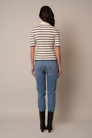 Model is wearing the Mock Neck Striped Pullover in Sand Heather/Black.