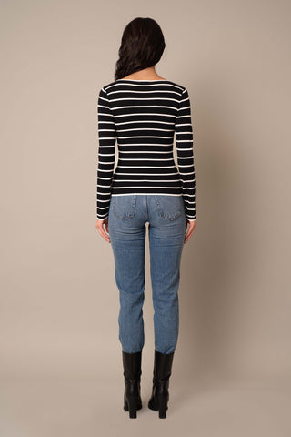 Model is wearing the Scoop Neck Striped Pullover in Black/Cream.