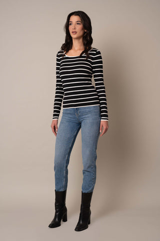 Model is wearing the Scoop Neck Striped Pullover in Black/Cream.