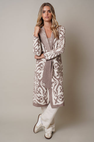 Model is wearing the Jacquard Hooded Dusterby Cyrus in Taupe Combo