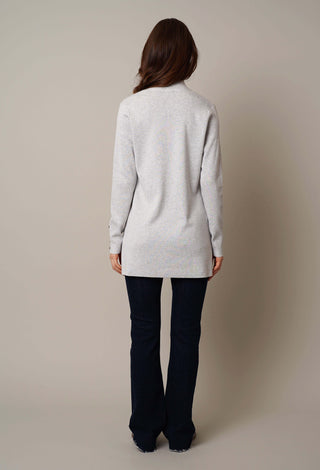 Model is wearing the open cardigan with shell button by Cyrus in Silver Heather Grey