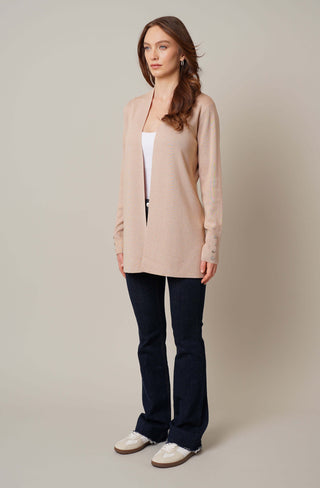 Model is wearing the open cardigan with shell button by Cyrus in Soft Camel Heather