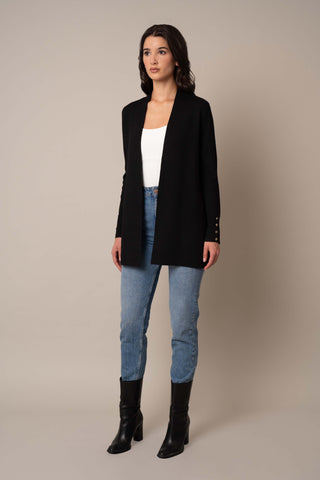 Model is wearing the Classic Open Cardigan in Black.