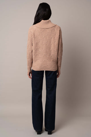 Model is wearing the cable-knit-cowl-neck-sweater in Toffee