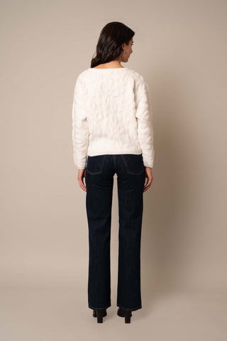 Model is wearing the Pullover Jacquard Sweater in Bone.