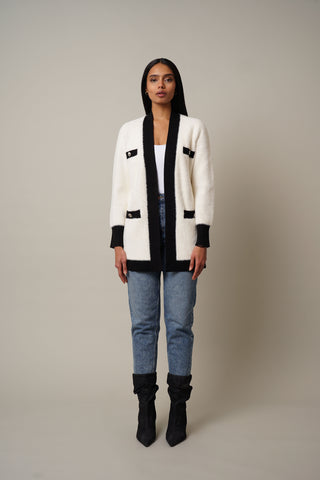 Model is wearing the Mink Open Cardigan with Trim in Vanilla Puff/Black.