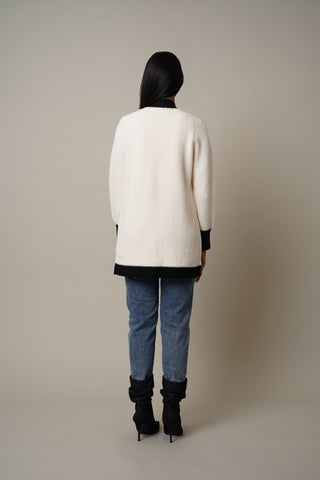 Model is wearing the Mink Open Cardigan with Trim in Vanilla Puff/Black.