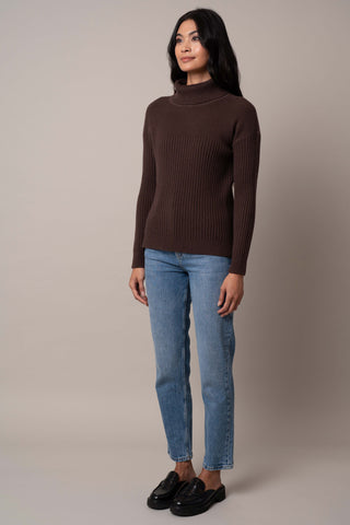 Model is wearing the wide-turtle-neck-pullover in Chocolate Brown