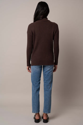 Model is wearing the wide-turtle-neck-pullover in Chocolate Brown