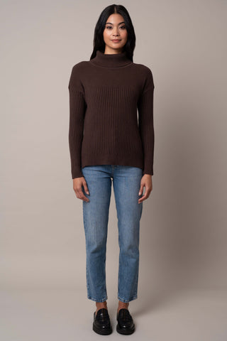 Model is wearing the wide-turtle-neck-pullover in Chocolate Brown