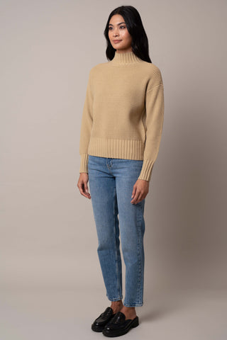 Model is wearing the waffle-mock-neck-pullover in Pale Olive