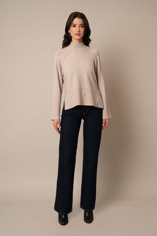 Model is wearing the Relaxed Mock Neck Sweater in Kitten Heather.
