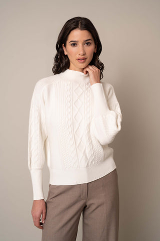 Model is wearing the Mock Neck Cable Pullover in Bone.