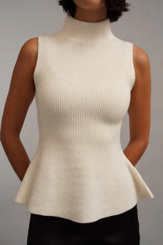 The Sculpted Peplum Turtleneck